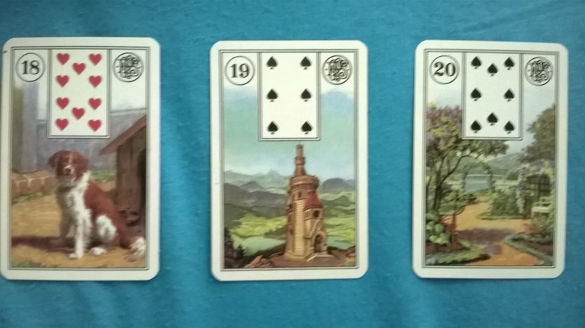 קלפים צועניים לנורמנד בתמונה כלב,מגדל,גן.